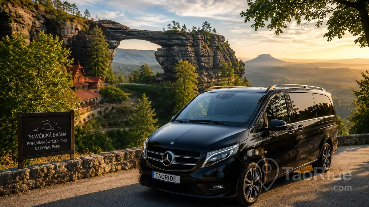 Luxury Mercedes private transfer overlooking Pravčická Gate in Bohemian Switzerland National Park, surrounded by sandstone cliffs, lush forests, and panoramic Czech landscapes near Hřensko.