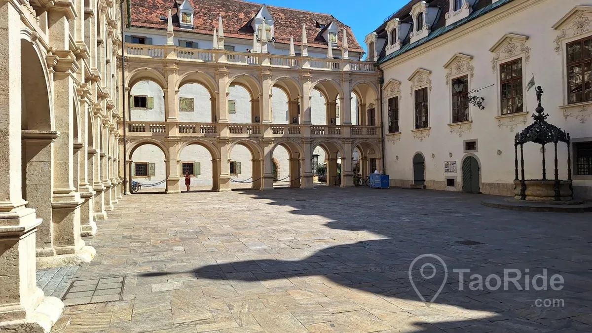 Graz Hauptplatz with historic buildings and Schlossberg Clock Tower in Austria