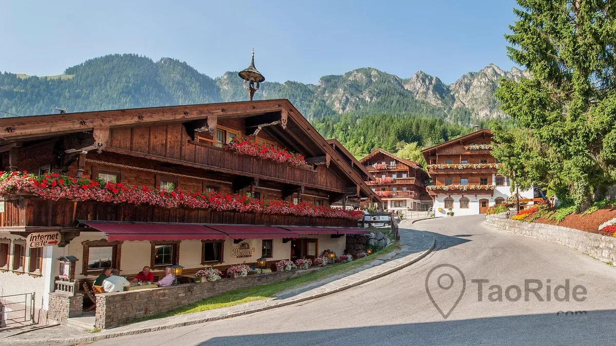 Historic center of Alpbach surrounded by the Tyrolean Alps