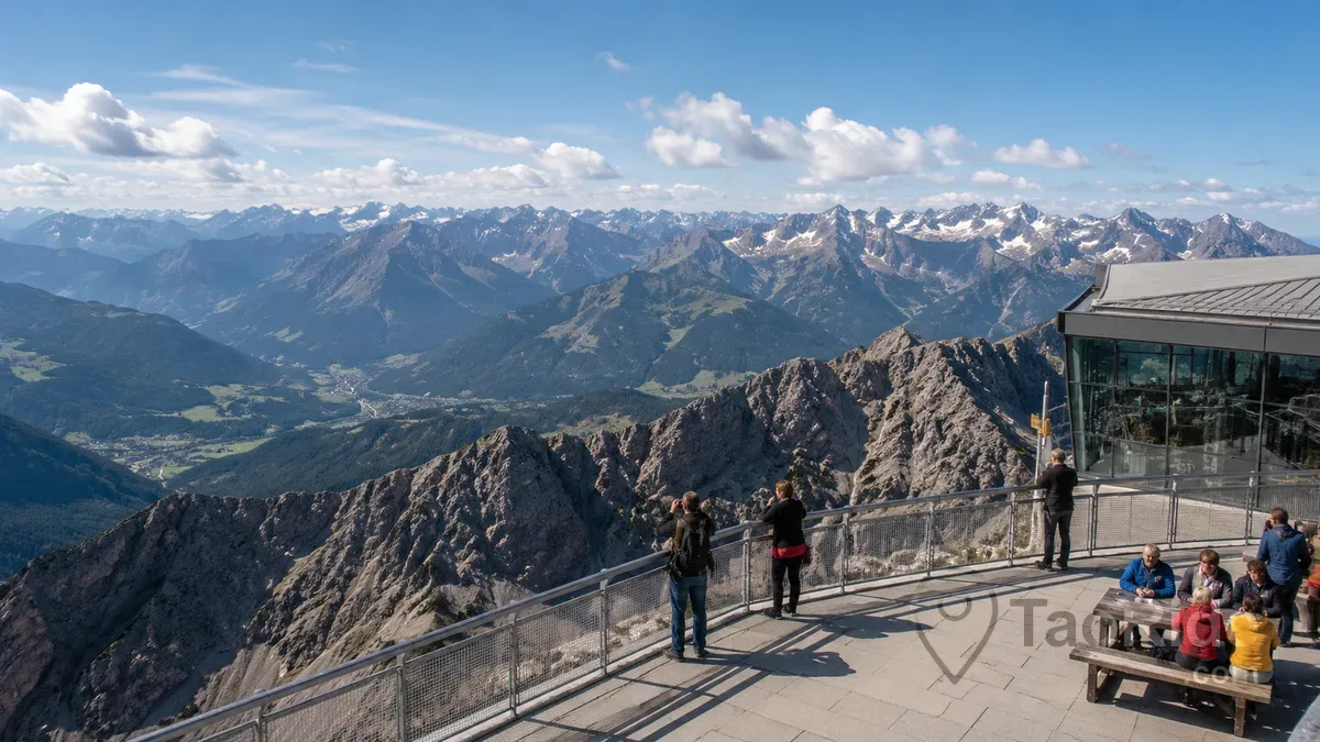 Visitors enjoying panoramic views from the Zugspitze summit observation terrace in the Bavarian Alps, Germany