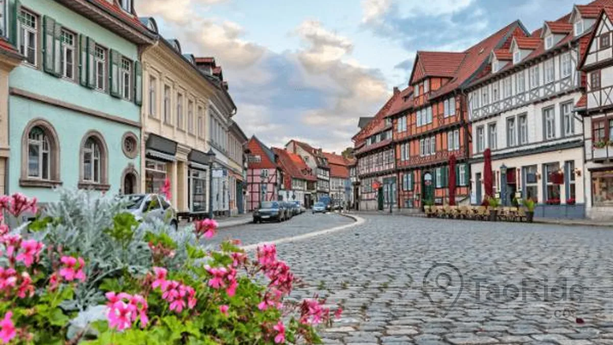 Cobblestone street lined with half-timbered houses in Quedlinburg Old Town