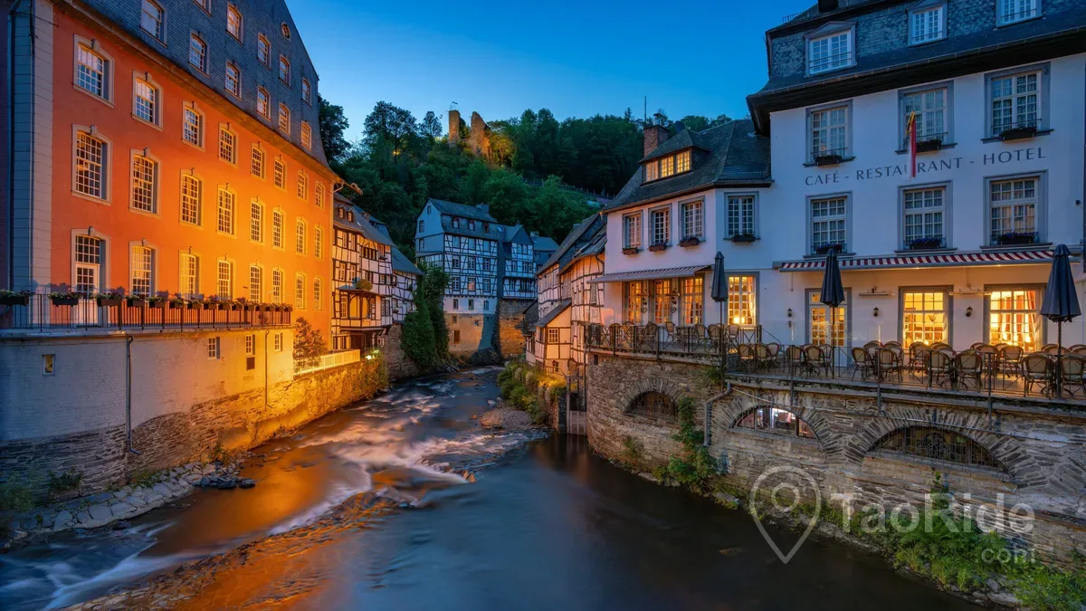 Historic Monschau Old Town with half-timbered houses beside the Rur River in the Eifel.