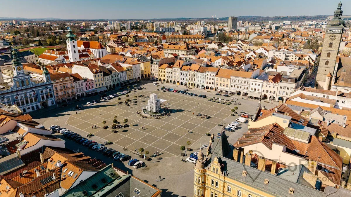 Historic center of České Budějovice featuring Přemysl Otakar II Square, the Black Tower, and Budweiser Budvar Brewery in South Bohemia, Czech Republic.
