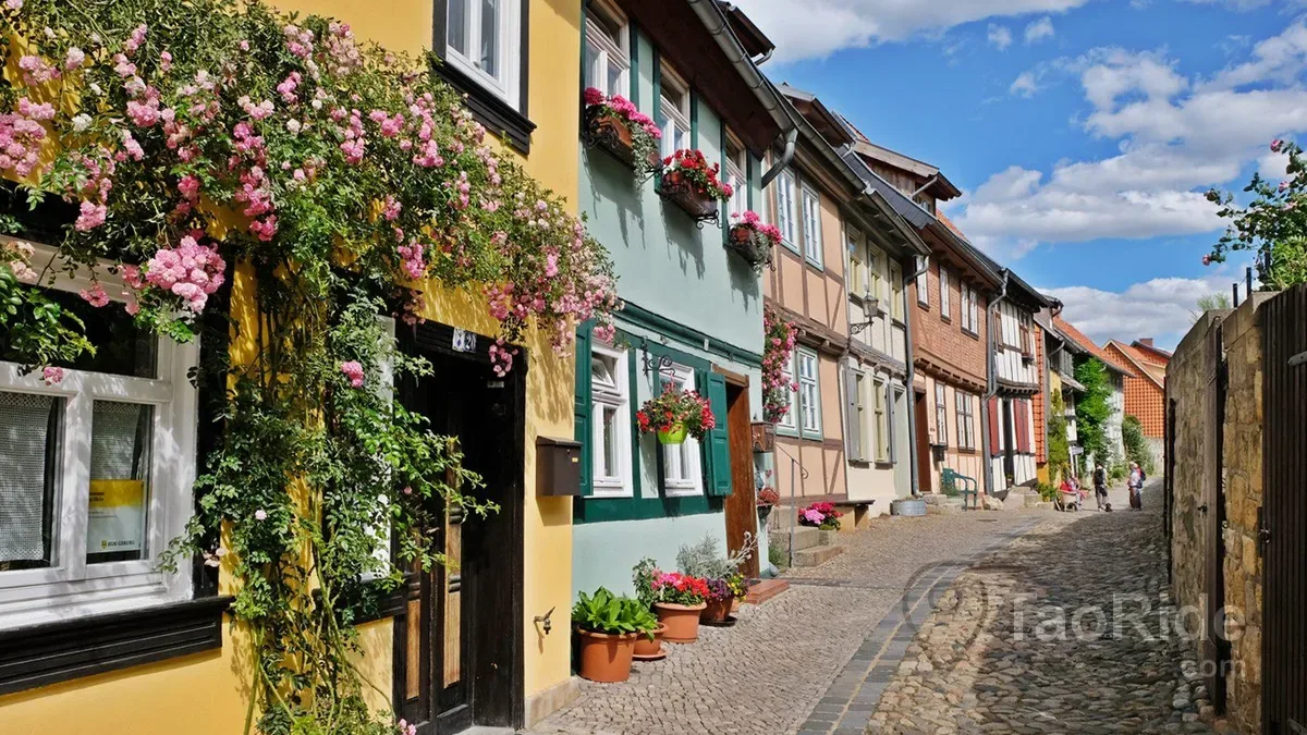 Cobblestone street lined with half-timbered houses in Quedlinburg Old Town